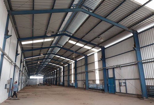 Large industrial shed interior workspace